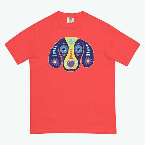 Gilmore & Friends multi colored on a blue background drawing for Day of the Dead on a vibrant paprika colored t shirt